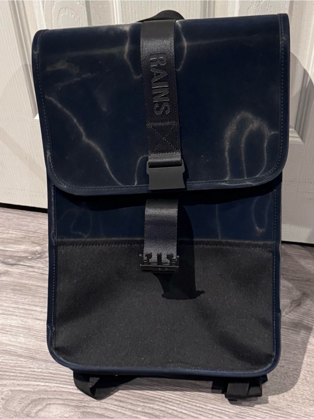 Rains Navy and Black Rolltop Backpack with Branded Strap